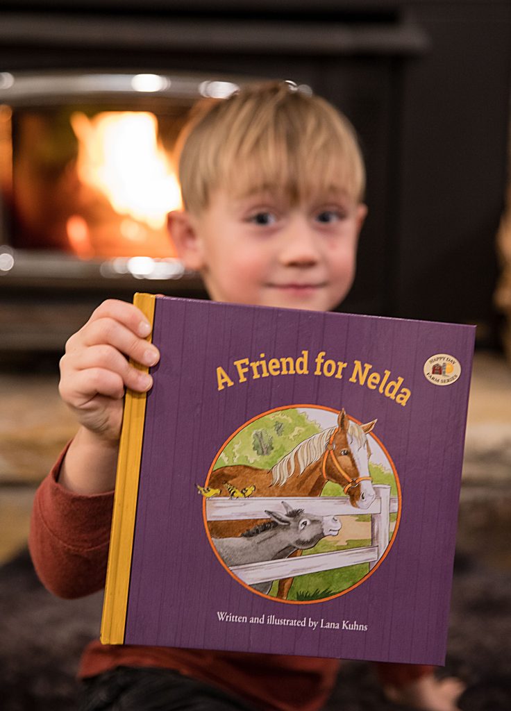 Blond boy with book