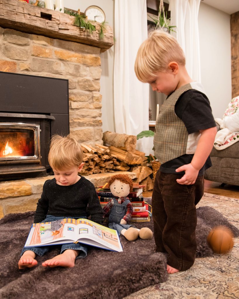 Two boys looking at book